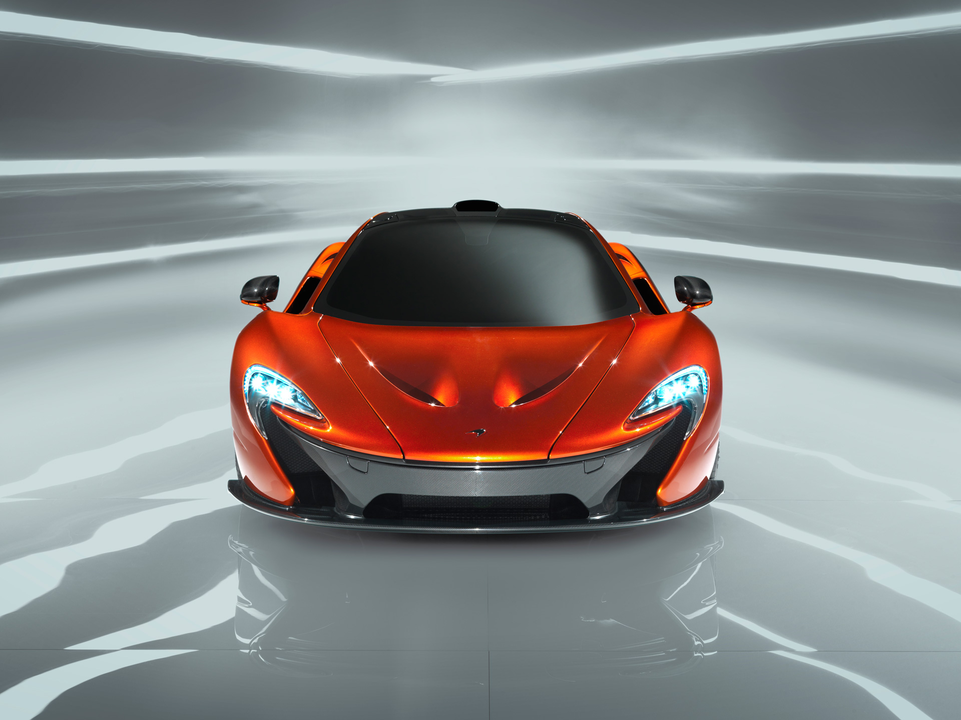 Front view of an orange McLaren P1.