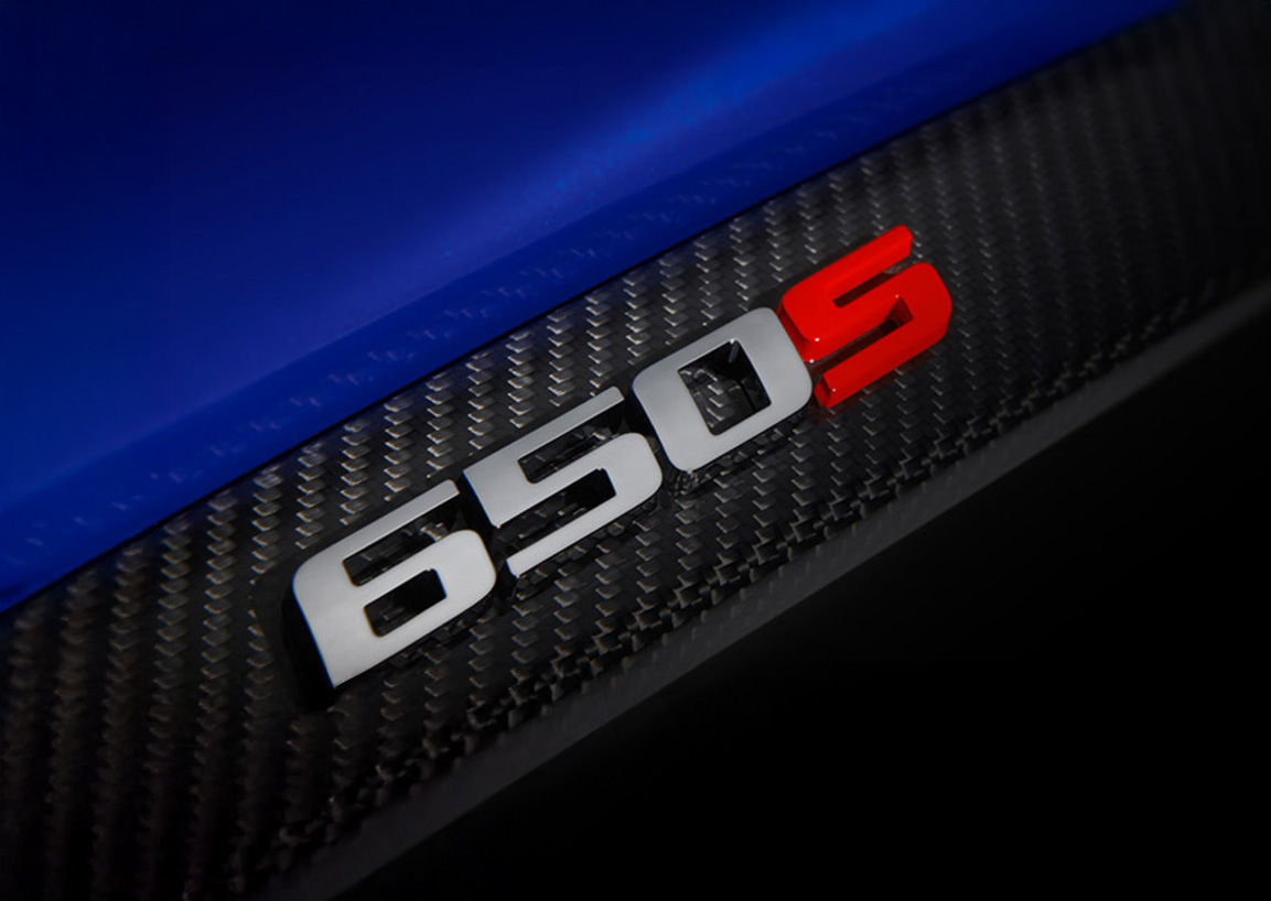 Close up of a McLaren 650S badge on the car body.