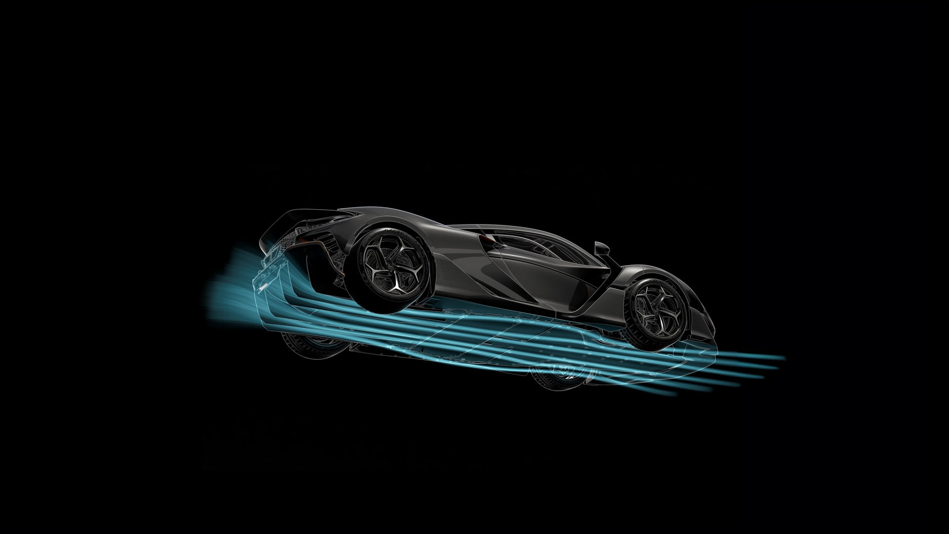 Dark McLaren W1 with blue lines depicting airflow running underneath the car. Photograph has been taken from below looking up. 