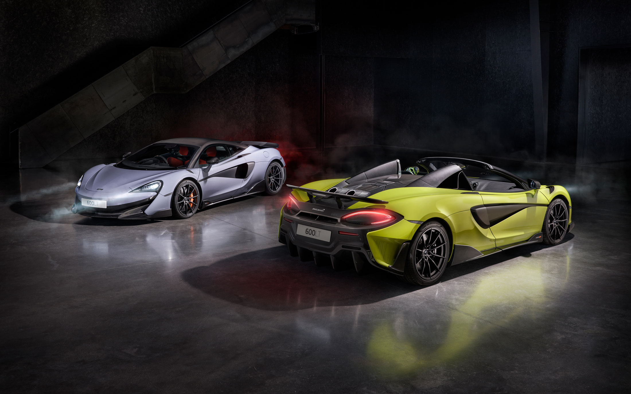 McLaren 600LT Coupe and Spider in an atmospheric setting, showcasing aerodynamics, lightweight design, and top-exit exhausts