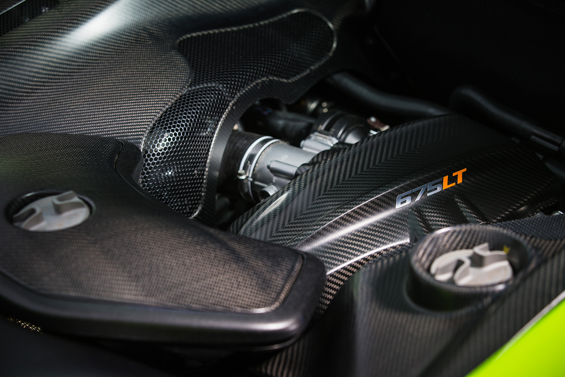 Close-up of McLaren 675LT engine bay showcasing LT technology innovation and performance upgrades