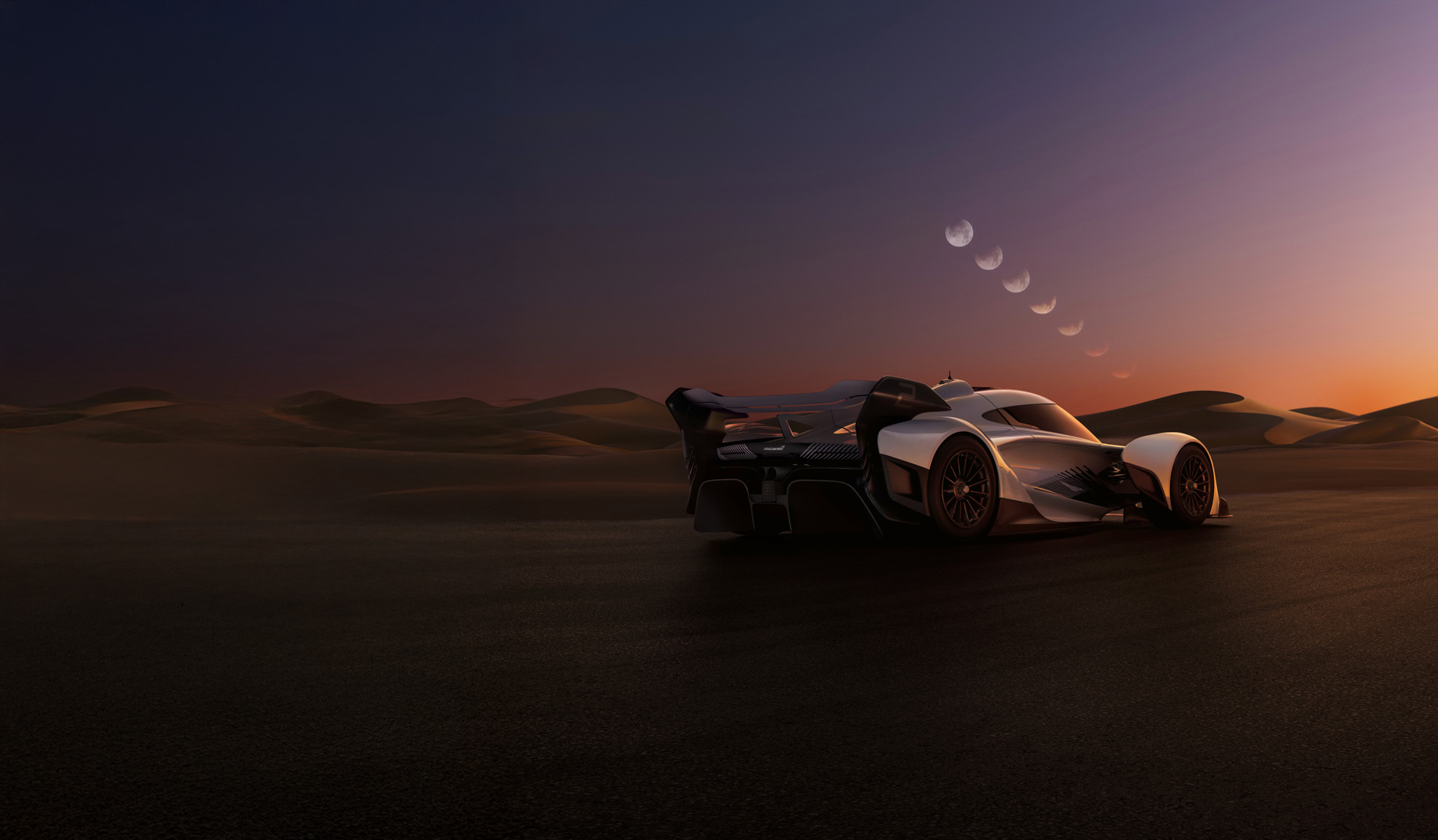  A digital rendering of the McLaren Solus GT, a single-seat track car, set against a desert landscape at twilight. 