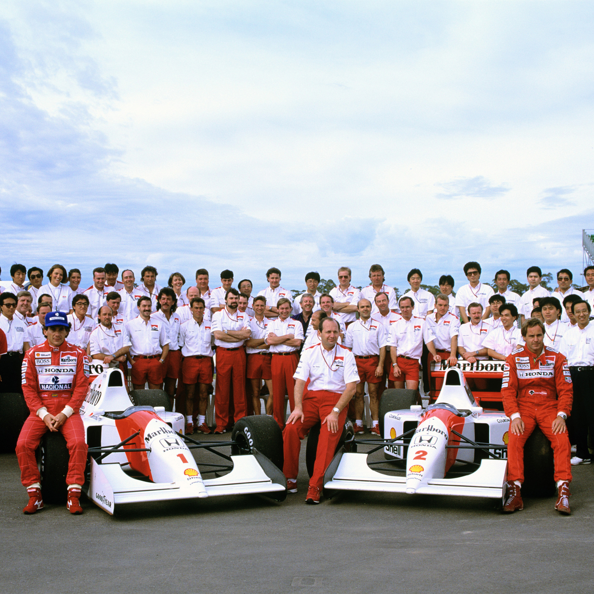 Team photo of the whole McLaren racing team and crew during the Ayrton Senna and Alain Prost racing era.