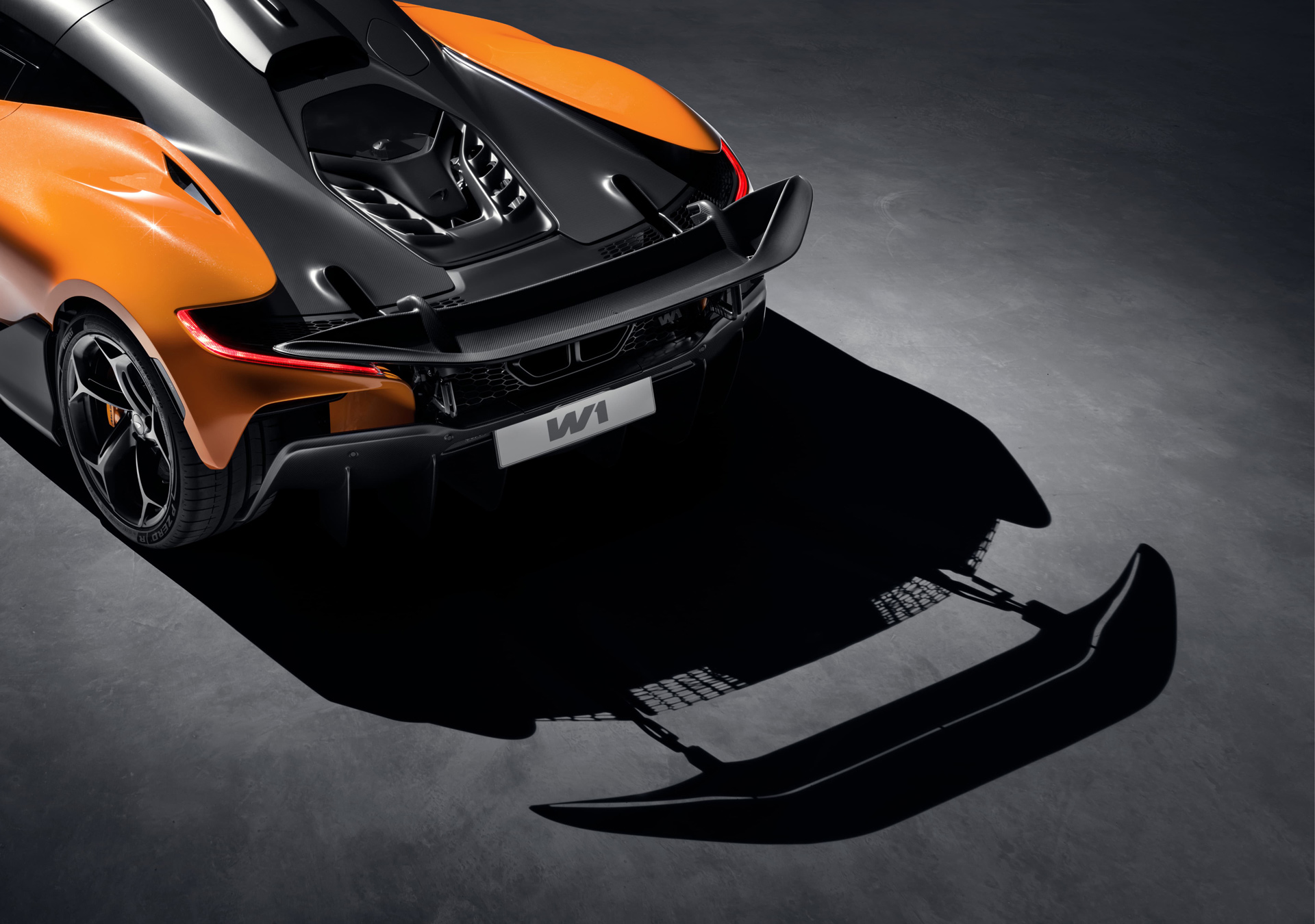 The rear of the McLaren W1, highlighting its bespoke active aero system, including the retractable tail wing and powerful diffuser.