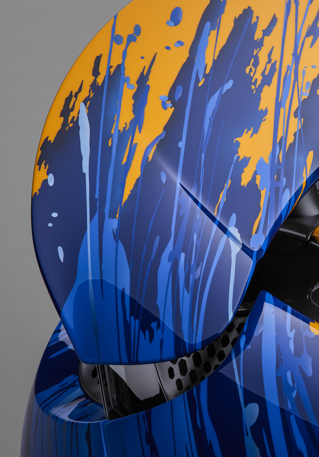 Close up of custom paint splat paint job on McLaren car body.