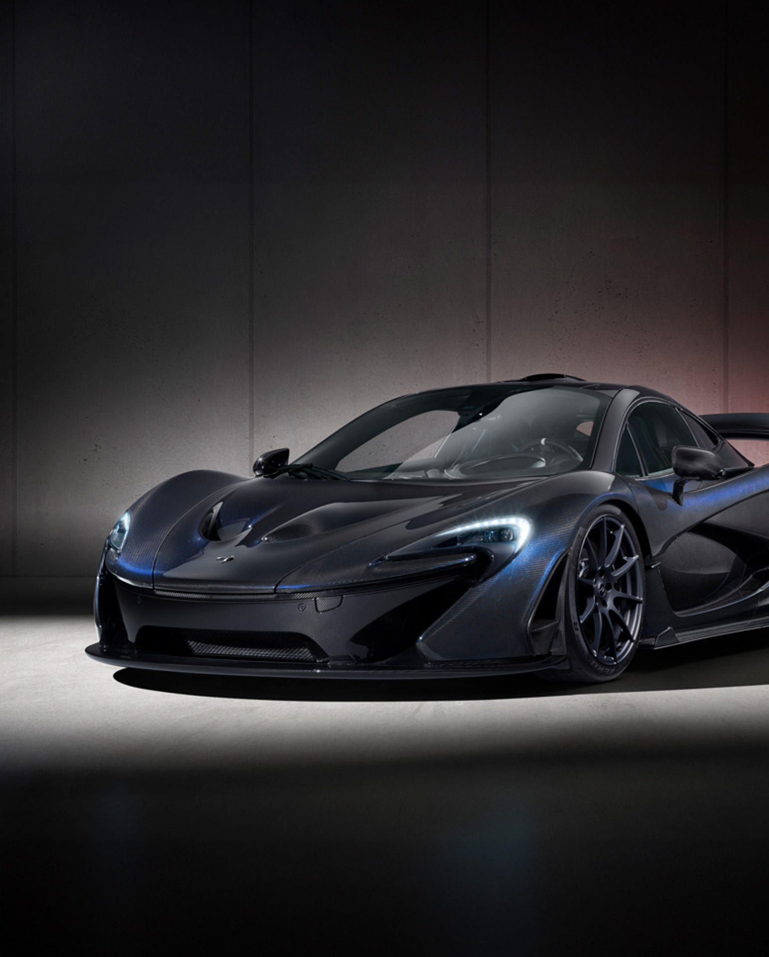 Restored, bespoke, black and blue McLaren P1. 