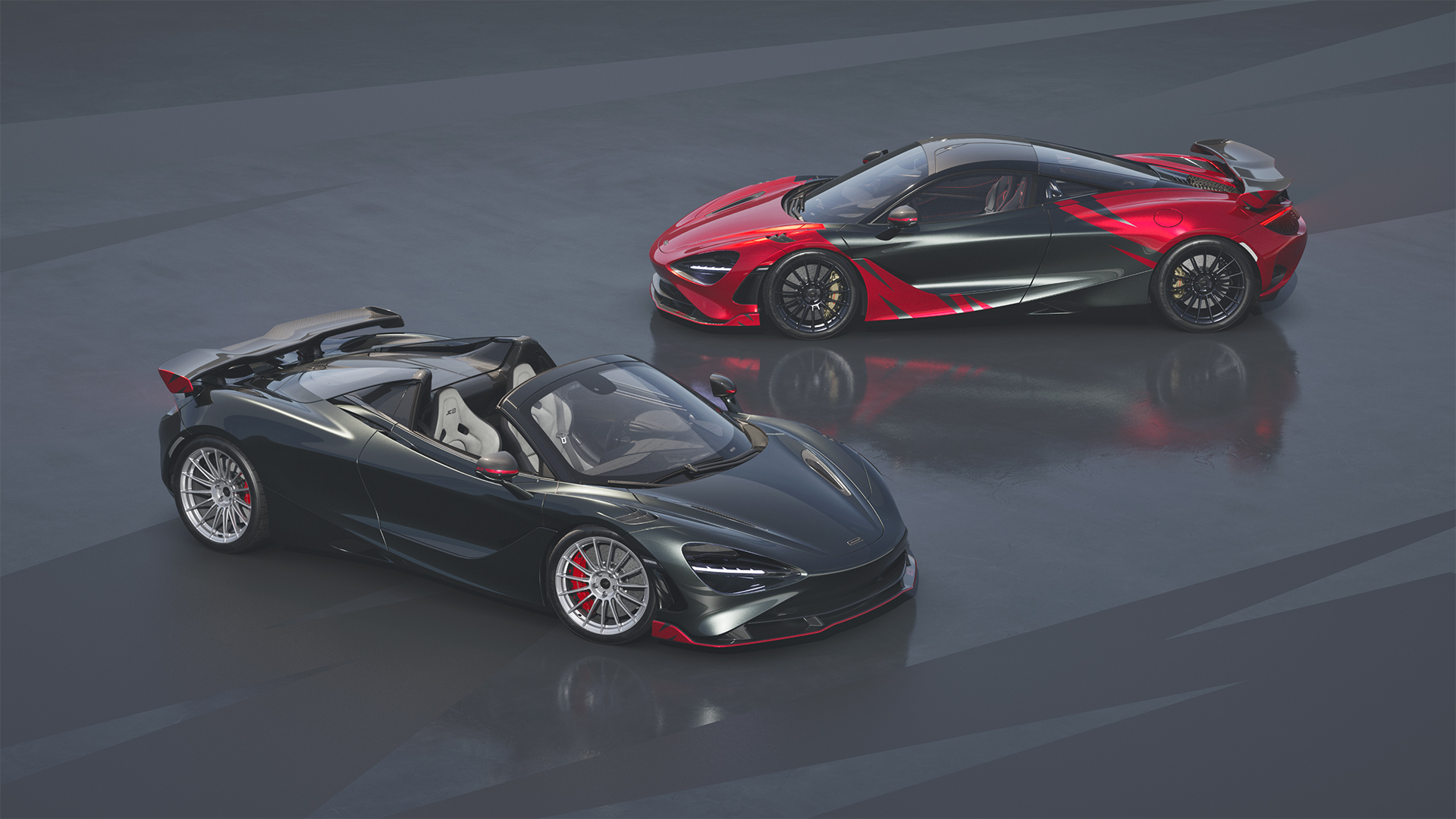 Aerial view of two McLaren 750S JC96 special edition models, a dark grey spider and a red and black coupe.