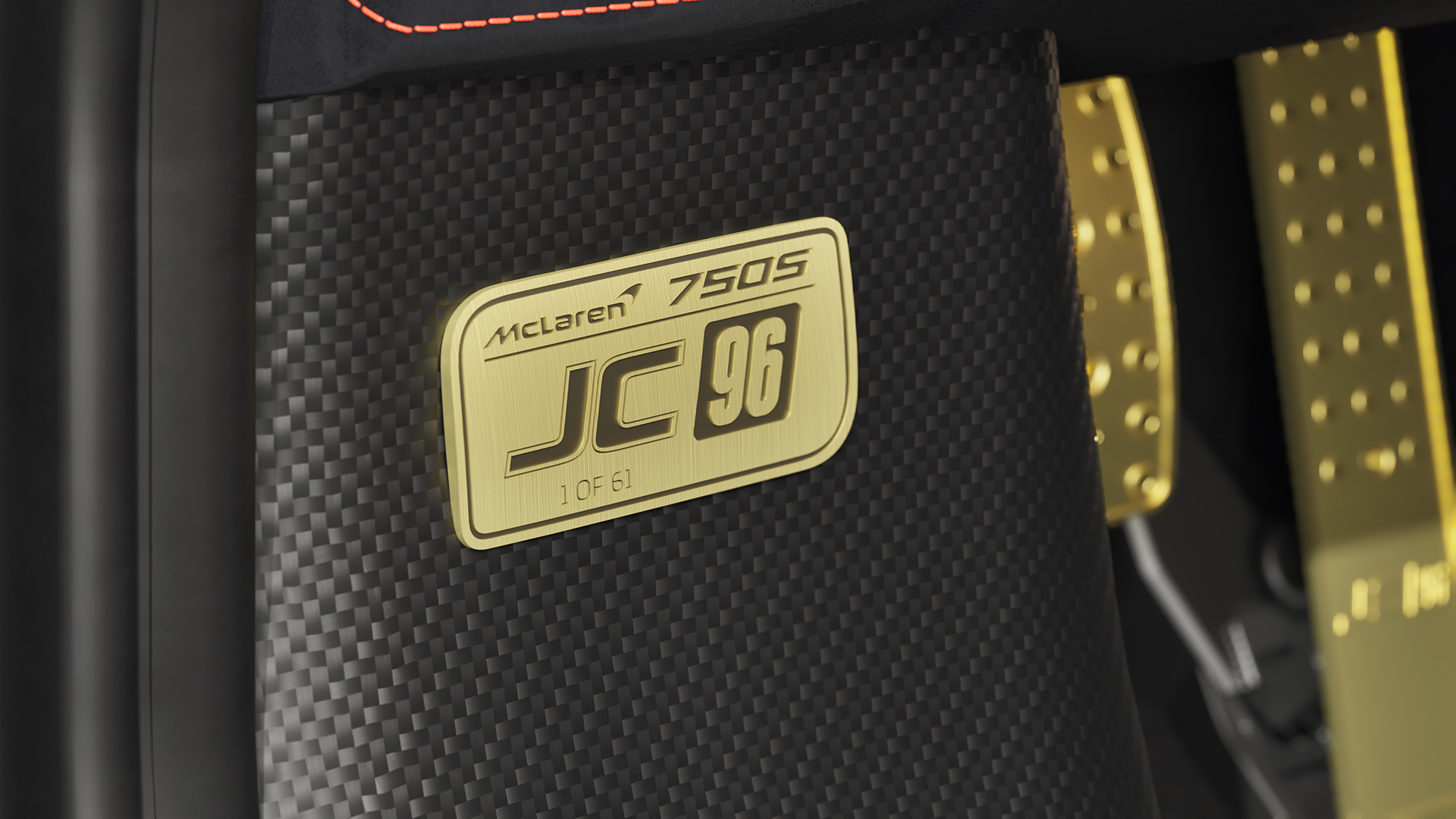 A close-up of the "McLaren 750S JC 96, 1 of 61" golden dedication plaque on the carbon fiber interior panel.