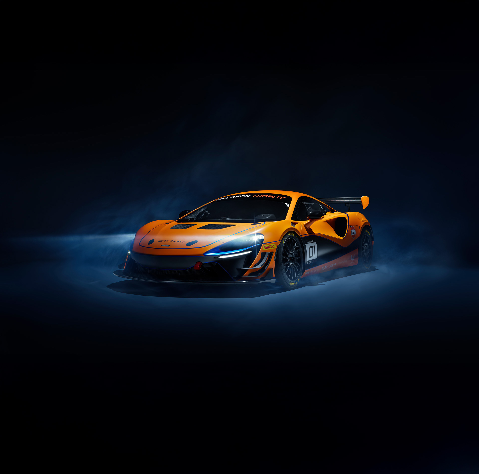 McLaren Artura Trophy with headlights on. 