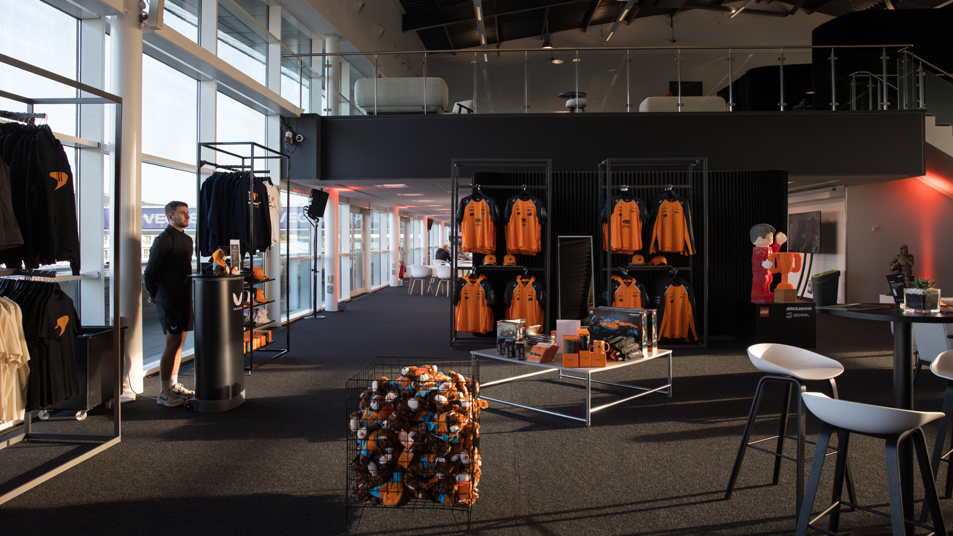 The inside of the McLaren merchandise store with a variety of memorabilia on display.