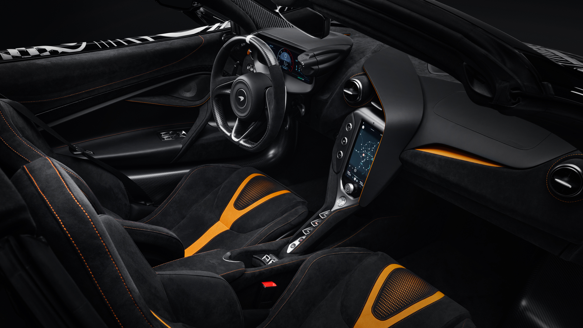 Interior shot of the McLaren 750S Project Viva cabin, showcasing the bespoke black Alcantara seats with contrasting McLaren orange accents and stitching, defining the MSO theme.