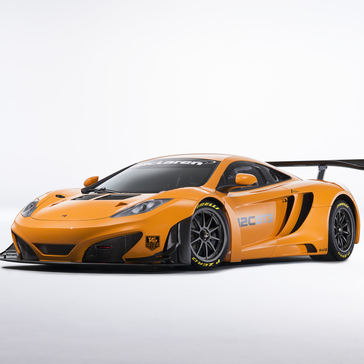 Orange McLaren 12C GT3 on a white background.