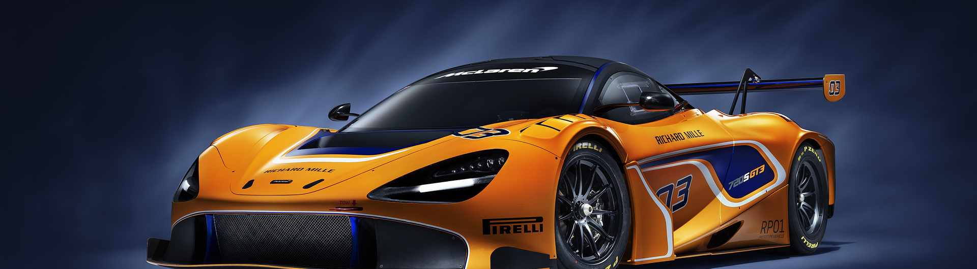 McLaren 720S GT3 photographed on a dark studio background.