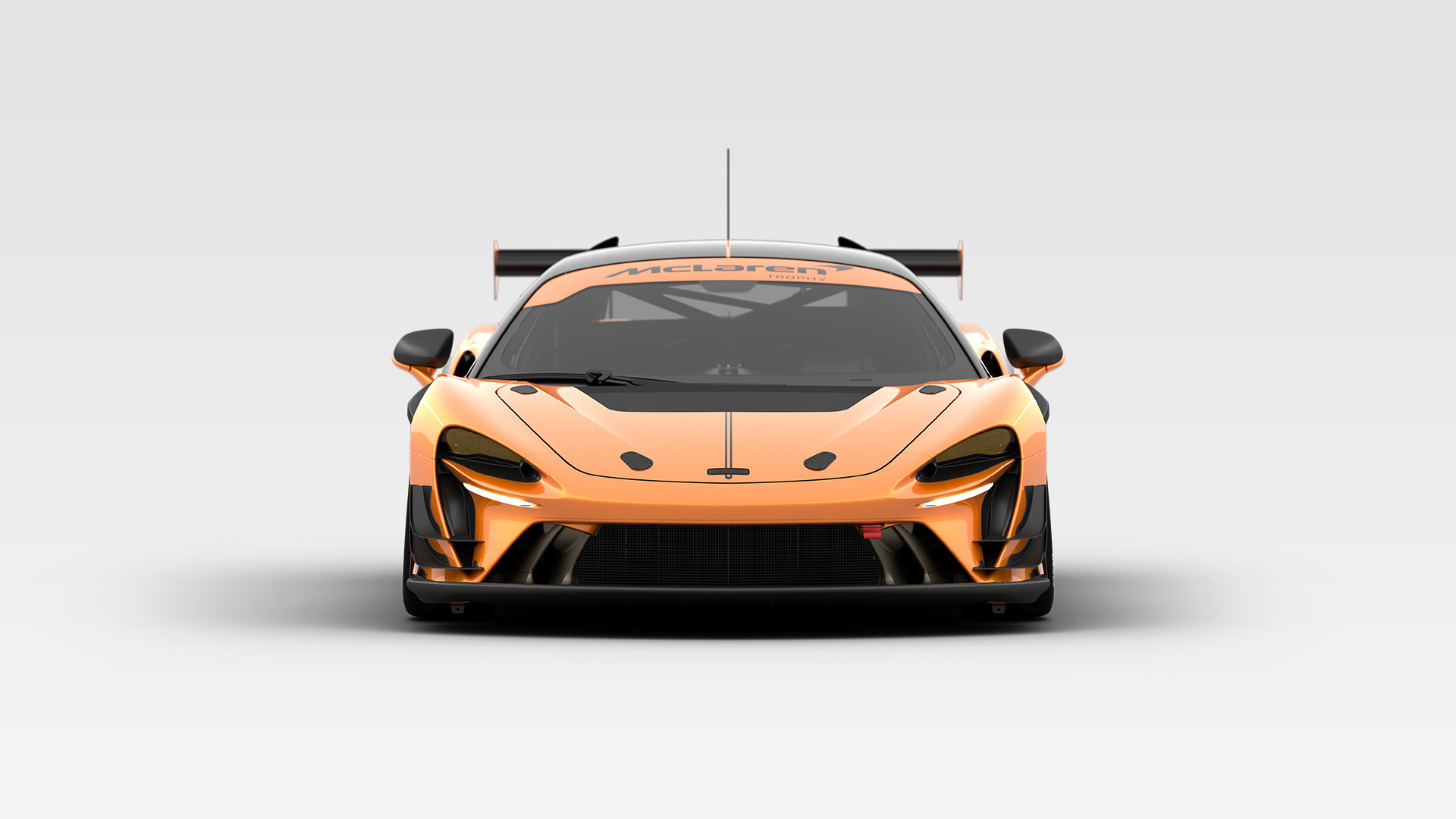 Front view of copper McLaren Artura Trophy EVO, in a white studio environment.
